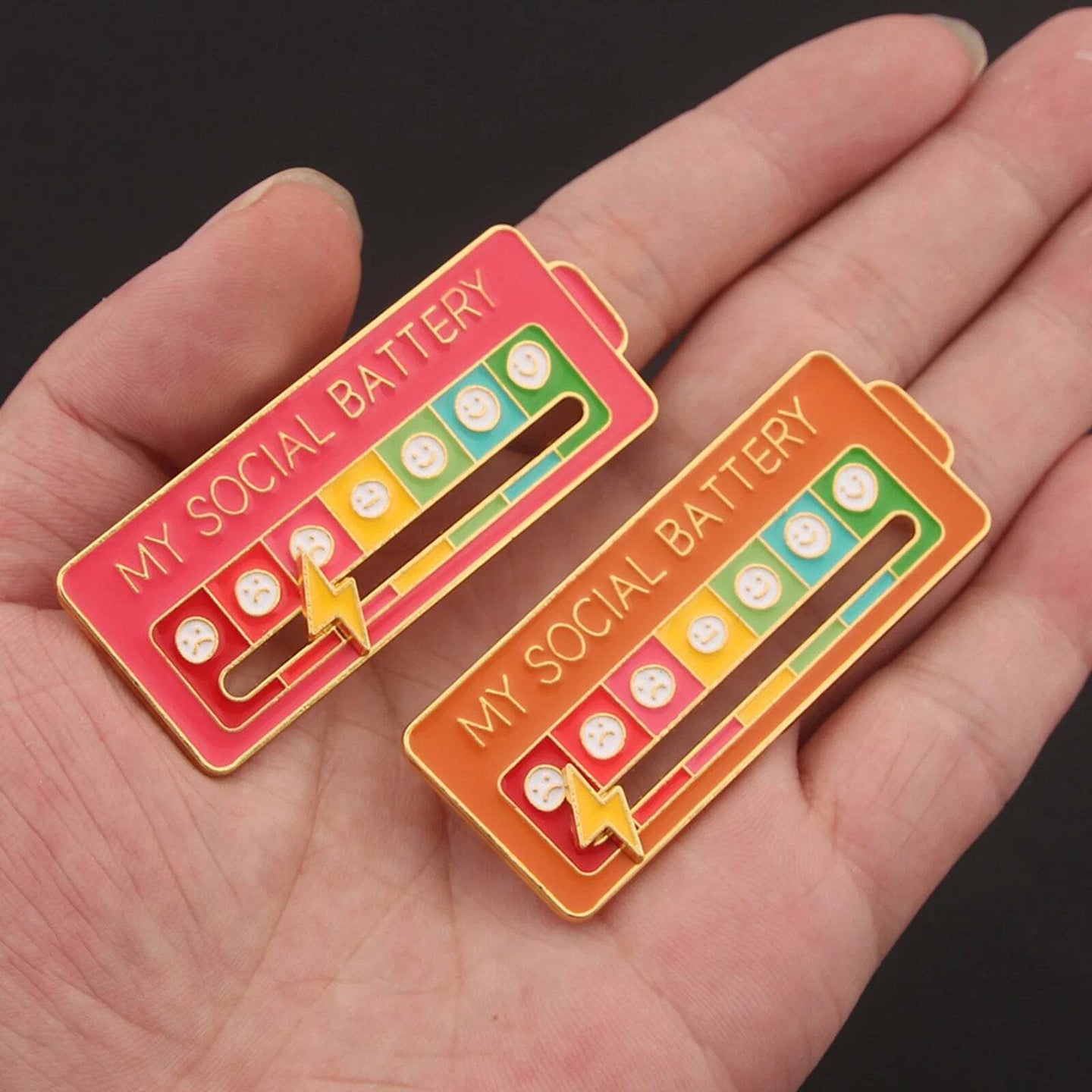 Red social battery badges on hand