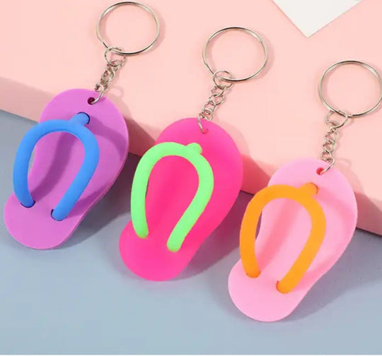 Mini Sandal Keychains in Peach, Pink and Baby Pink displayed on a white background