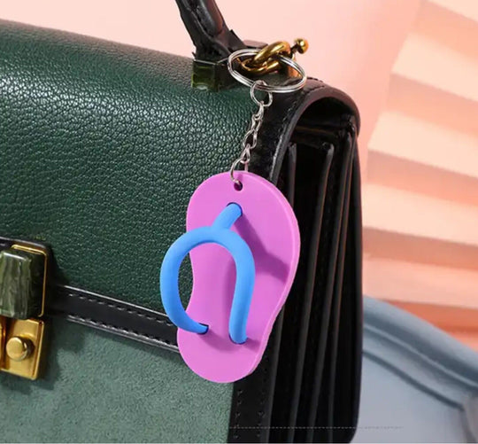 Mini Sandal Keychains in Peach displayed hanging on a Handbag 
