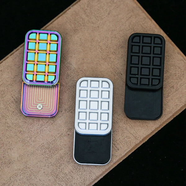 hand holding chocolate-style magnetic fidget slider at office desk