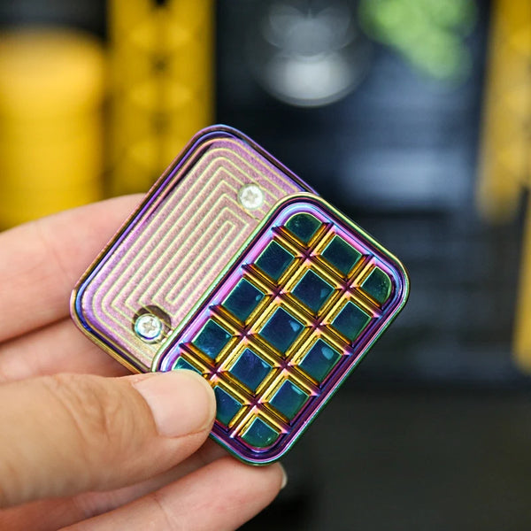 magnetic fidget slider in silver chocolate design on work keyboard