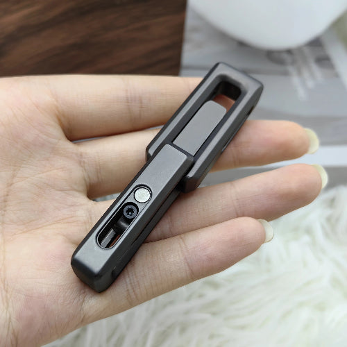 Hand holding magnetic double push fidget toy showing compact EDC pocket-size design for anxiety relief