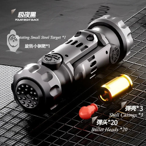 Close-up of stainless steel gun fidget toy black finish with mini target and bullet shells – Chys Thijarah UK