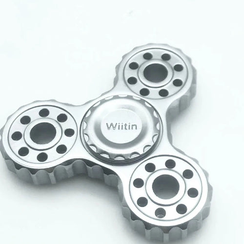fidget rings for anxiety ratchet being worn on finger as discreet EDC stress relief tool for office and study