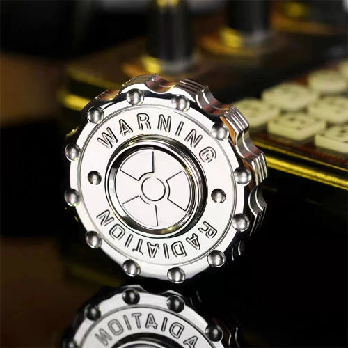 Radiation Warning EDC Fidget Slider UK Spinner on office desk – compact anxiety relief fidget toy for work and study