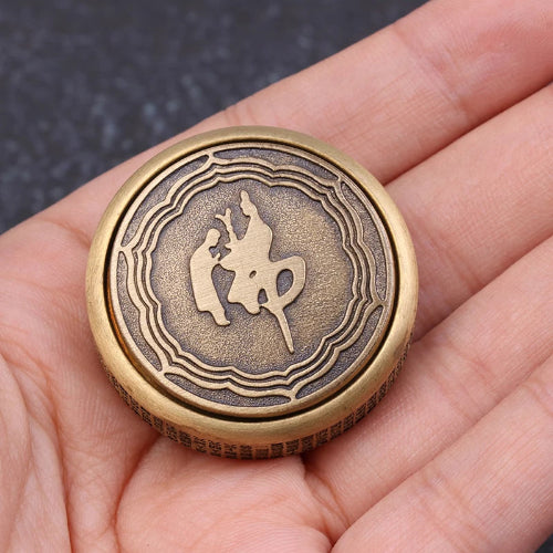 Close-up of spinning EDC fidget spinner. with meditation symbols