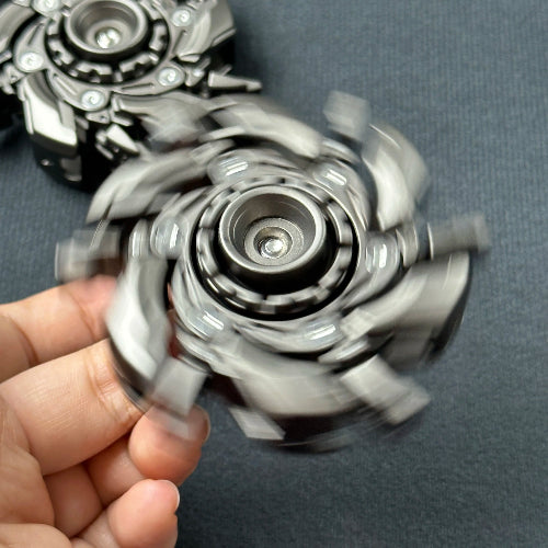 Hand holding Open Armour fidget slider grey – focus and anxiety relief tool