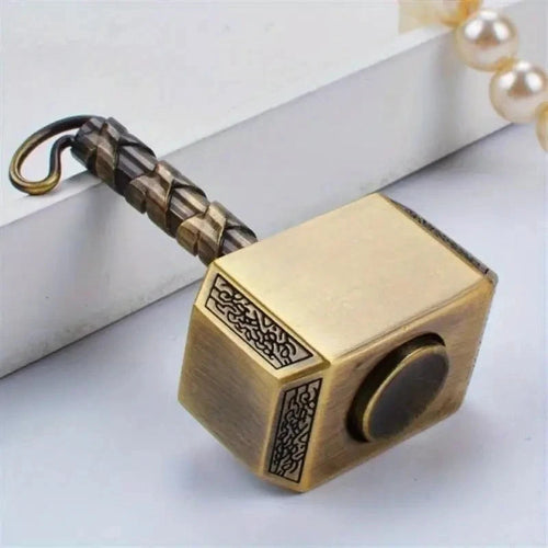 golden mini hammer fidget spinner stainless steel close up