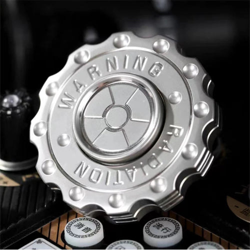 Side view of Radiation Warning EDC Fidget Slider UK Spinner showing radiation design – metal fidget slider toy for ADHD and focus