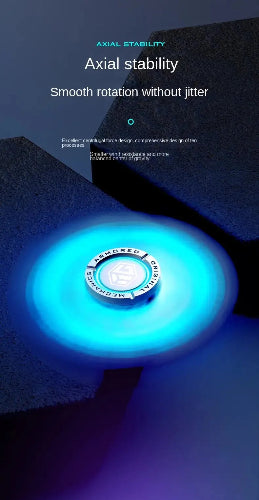 orange EDC glowing metal spinner on desk workspace setup