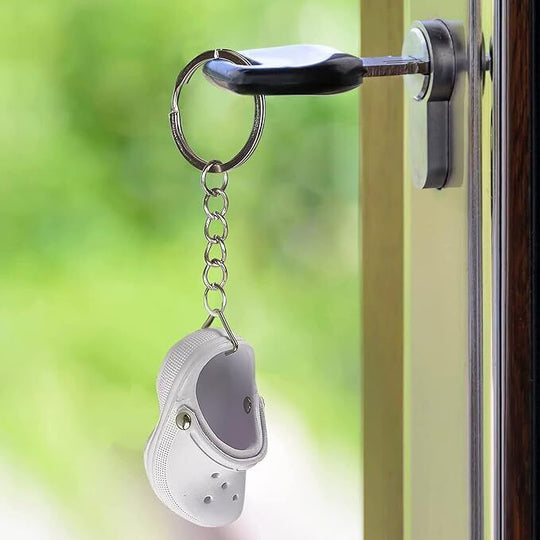 Floating Foam mini Croc White shoe hanging on a key