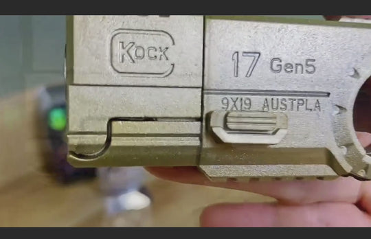 close-up of CNC machined fidget gun gold toy for ADHD and anxiety relief