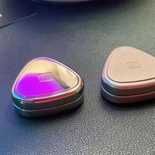 Gradient-coloured Rice Ball Fidget Slider spinner on a dark background, showing reflective surface