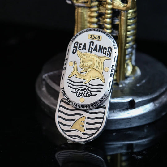 Shark Premium Fidget Slider displayed on desk with accessories