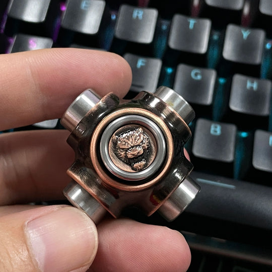 X-BONE Tiger Spinner placed on mechanical keyboard as desk toy
